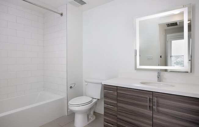 an empty bathroom with a toilet and a sink