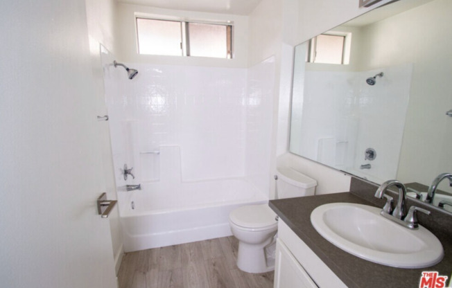 Bright hardwood floor apartments! *Fireplaces* *Gated Parking* *Stone Countertops* *Stainless Steel Appliances*