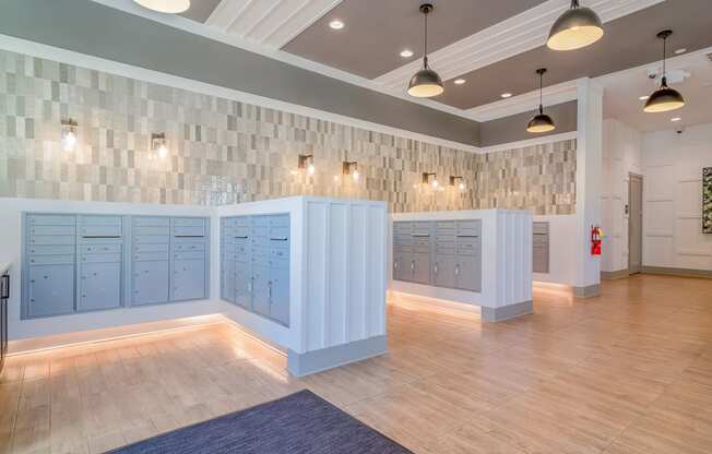 the locker room at the gym has blue lockers and a wood floor at Carmel Vista, McDonough, GA