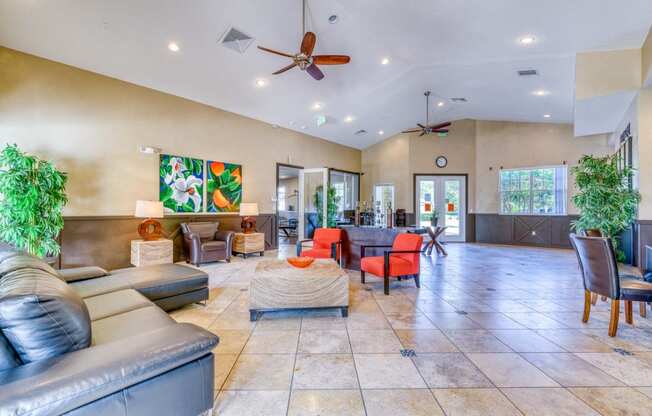 a living room with couches and chairs and a dining room table