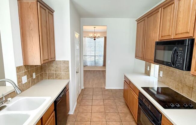 Spacious Two-Story in Hidden Creek – Primary Suite Down, Built-In Theater Up
