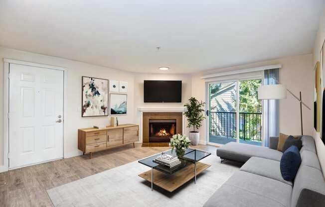 a living room with a fireplace and a tv above it