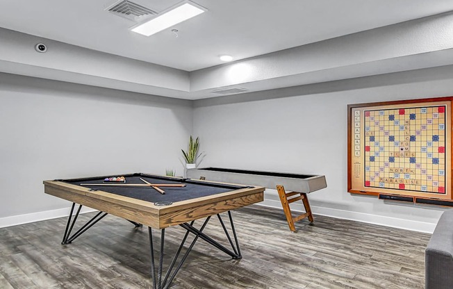 the retreat apartments l game room with pool table and foosball