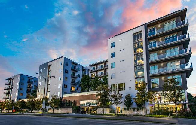 A modern apartment building with a street in front.