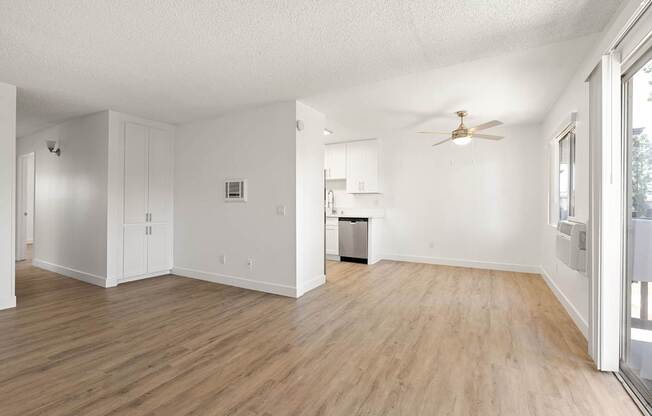 A room with wooden floors and white walls.