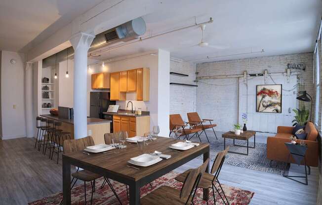 A dining room with a wooden table and chairs.