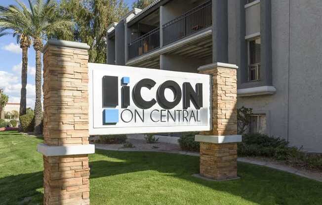 A sign that says Icon Central in front of a building.