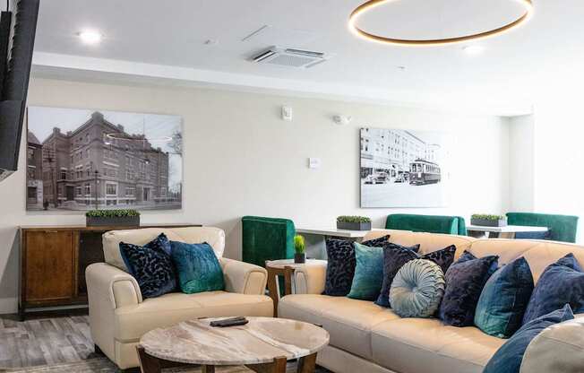 A living room with a white couch and a coffee table.