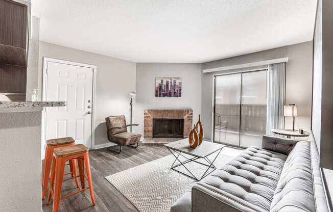 a living room with a couch and a fireplace