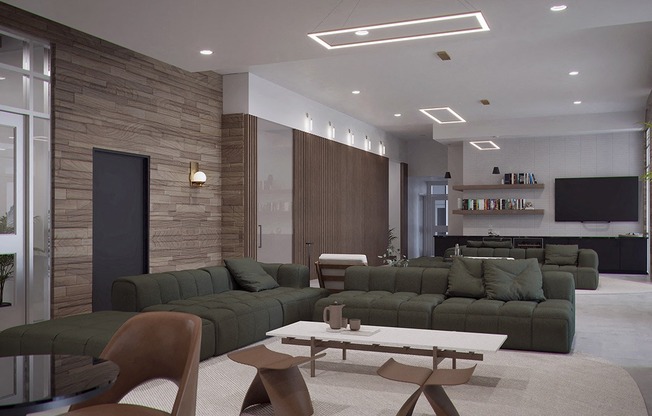 a living room with green couches and a table