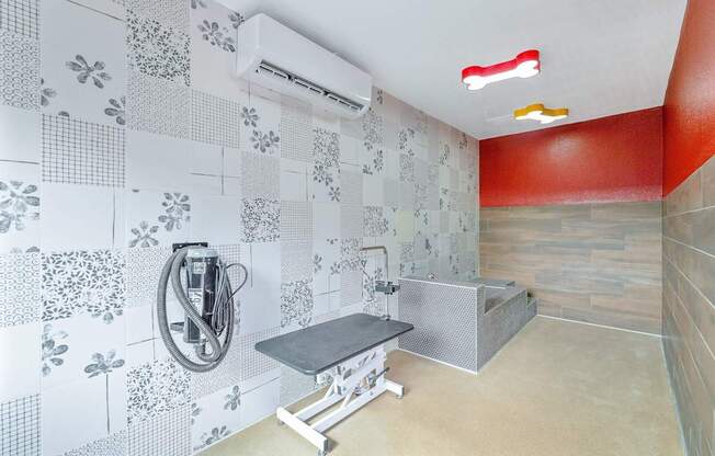 A bathroom with a shower and a bench.