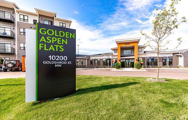 Property monument sign in the grass in front of the leasing building