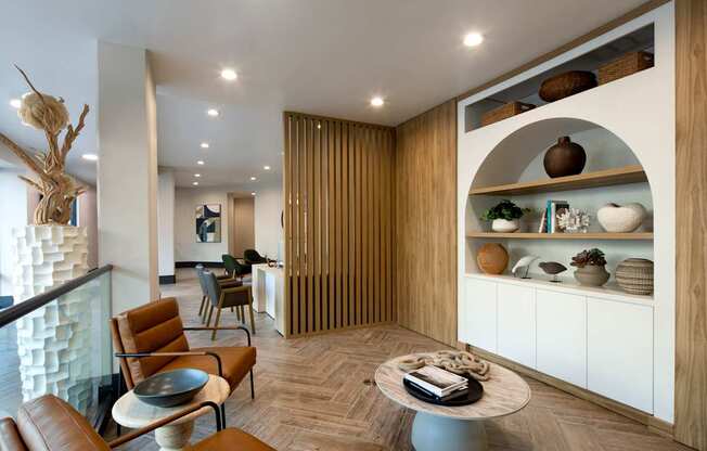 A modern living room with a wooden accent wall and a glass railing.
