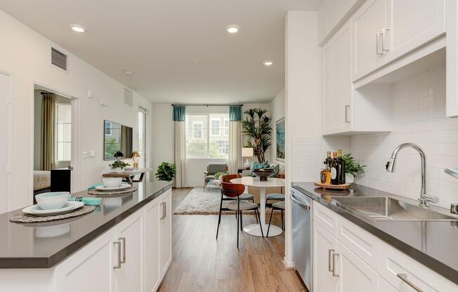 a kitchen with a sink and a mirror