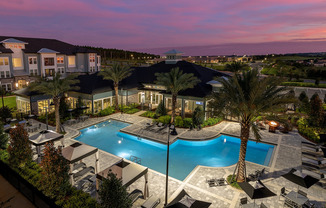 View of Cottonwood Clermont Exterior Showing Pool and Twilight Sunset