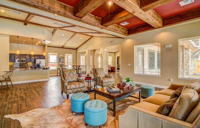 a living room with a coffered ceiling and a kitchen in the background at Villa Espada Apartments, San Antonio