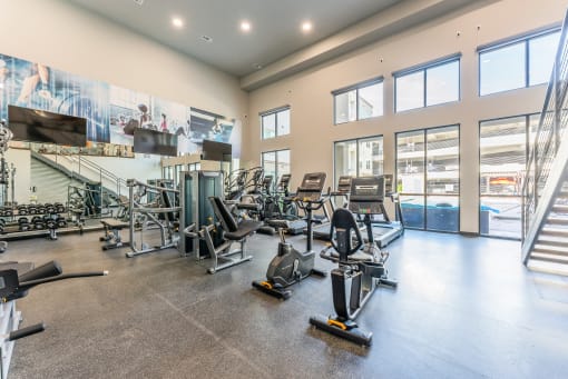Fitness Center With Outside View at Residences at 3000 Bardin Road, Grand Prairie, TX, 75052