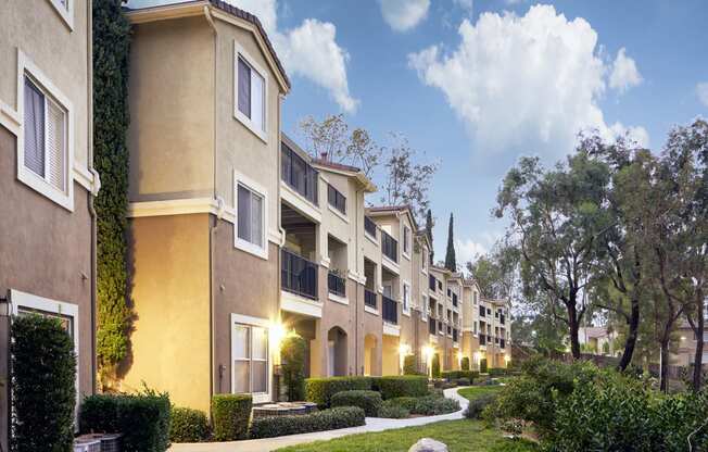 Escondido, CA Apartments - Exterior View of Alta Vista Apartments Building Surrounded By Lush Landscaping