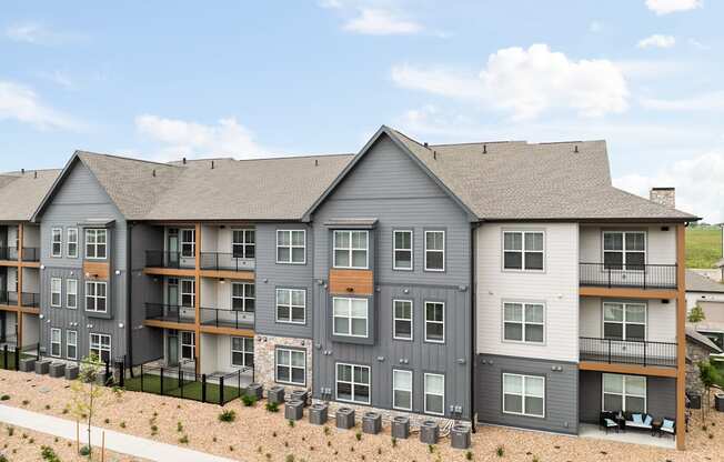 an aerial view of an apartment building on a sunny day