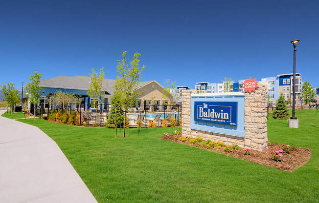 the preserve at ballantyne commons community entrance with green grass and a brick sign