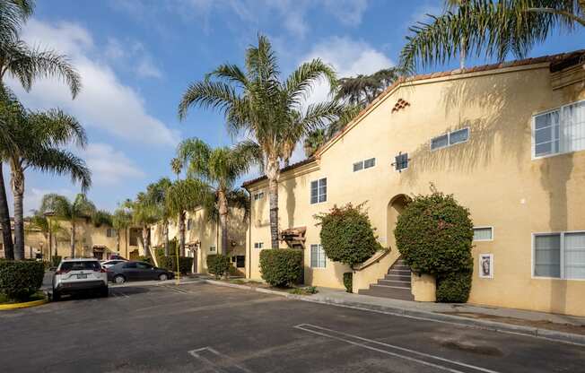 A building with a parking lot in front of it.