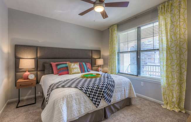 Bedroom with large bed and ceiling fan
