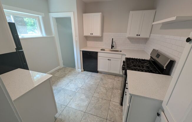 Beautifully renovated 2 bedroom house with new kitchen, bathroom and 2 car garage.