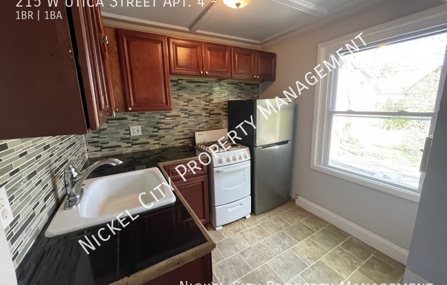 215 W UTICA ST