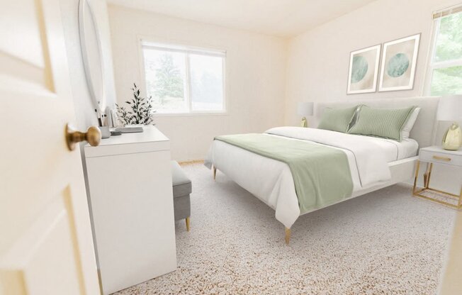 a bedroom with a white bed and green blanket