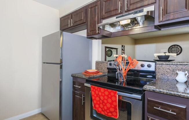 a kitchen with a stove top oven sitting inside of a refrigerator