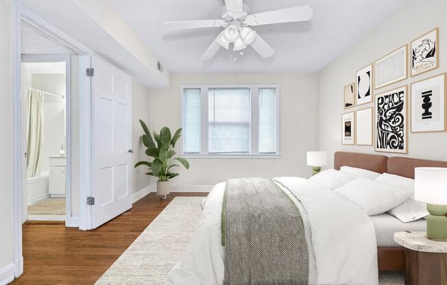 an open bedroom with a bed and a ceiling fan