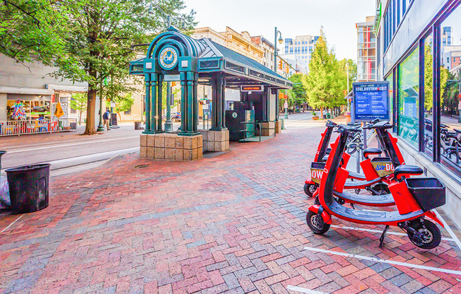 a red scooter parked in front of a store