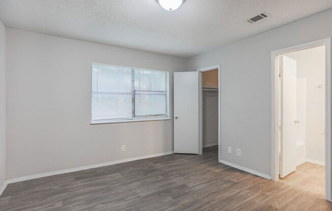 The element 4411, Macon, GA Apartment  spacious bedroom with hardwood flooring