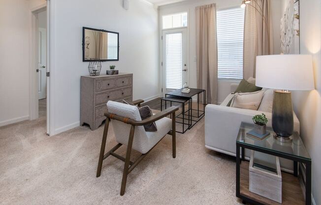 a living room with a couch and a chair