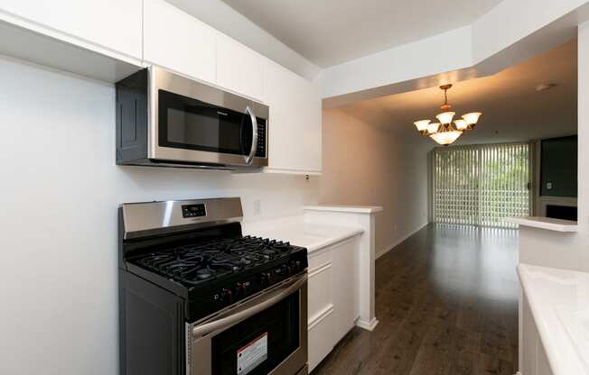 Kitchen with Stainless Steel Appliances and White Cabinets