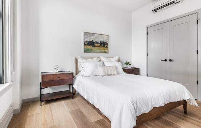a bedroom with a large white bed and a window at The Commonwealth Building, Pittsburgh, 15222