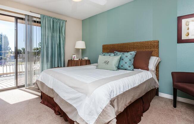 a bedroom with a large bed in a hotel room