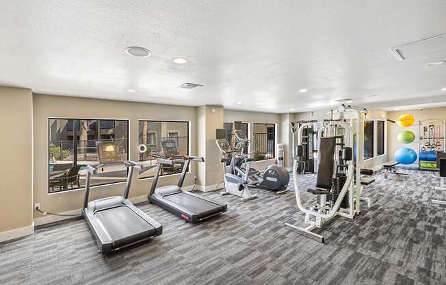 Community Fitness Center with Equipment at Saddle Ridge Apartments in Tucson, AZ.