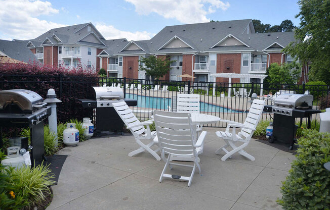 Grill Area with pool view one of the luxury amenities at Falcon Creek in Hampton VA