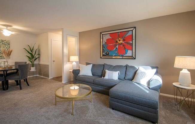 This is a photo of the living room in the 822 square foot, 2 bedroom, 1 bath floor plan at Village East Apartments in Franklin, OH.