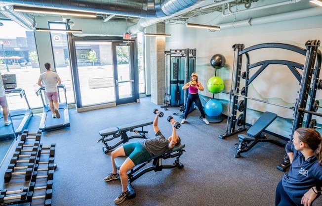 a group of people working out in a gym