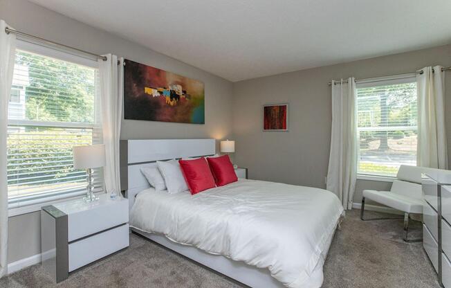 a bedroom with a large bed in a room