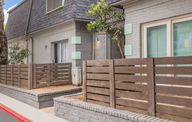 a wooden fence in front of a house