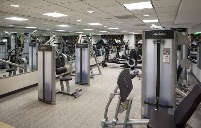 a gym full of exercise equipment at the allegiant convention center