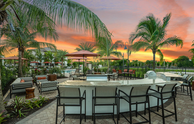 Resort-style outdoor kitchen at Palm Ranch Apartments in Davie, FL