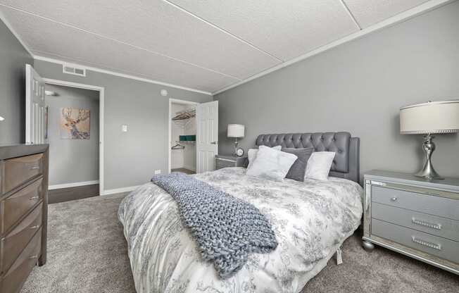 Renovated Bedroom with bed at Woodland Ridge Apartments in Woodridge, IL