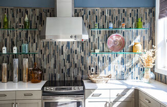 a small kitchen with a stove and a sink