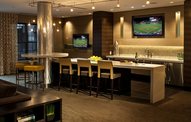 Contemporary Club Room With Bar Area, TV & Numerous Seating Areas