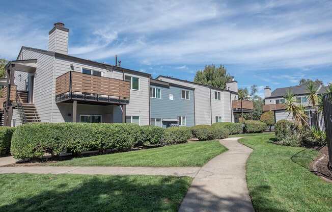 A green space in front of apartment buildings at Sierra Glen Apartments, California, 95621