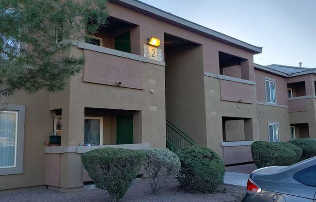 A building with a green door and a number 21 on the wall.